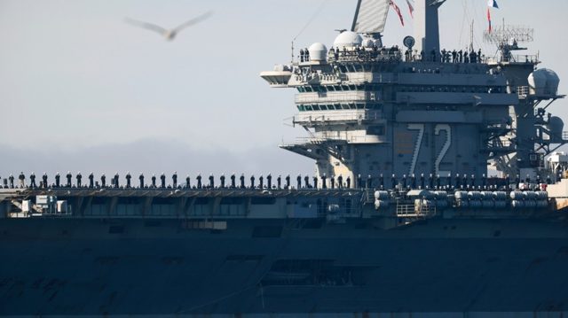 Burned-out US aircraft carrier sailors near Iran tried to jump overboard – media