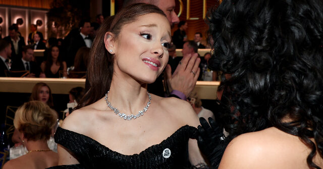 Pop Star Ariana Grande Flaunts ‘ICE OUT’ Pin at Golden Globes