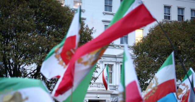 Protester Hoists Pre-Islamic Revolution Iran Flag Above London Embassy