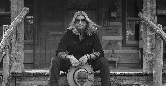 Exclusive — Country Singer-Songwriter Ira Dean Hopes ‘What Would Charlie Daniels Do’ Unites Us: I Love Our Flag, Breaks My Heart to See People Burn It
