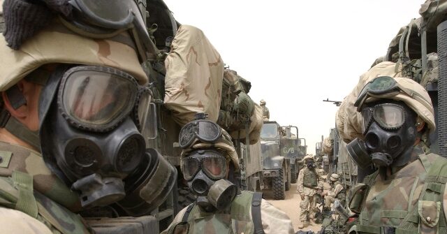 U.S. Marines and Paratroopers Conducting Drills for Chemical and Nuclear Hazards en Route to Mideast