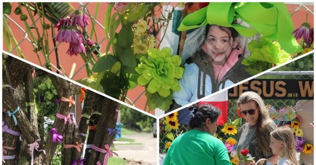 Mourners Gather at Kerrville Memorial Display in Aftermath of Texas Floods