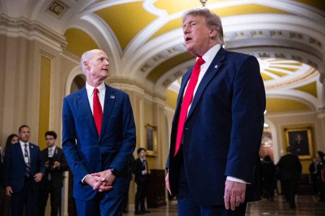Rick Scott says he’s just trying to help