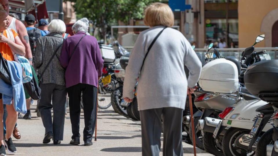 Elderly women in Mallorca walking with sticks