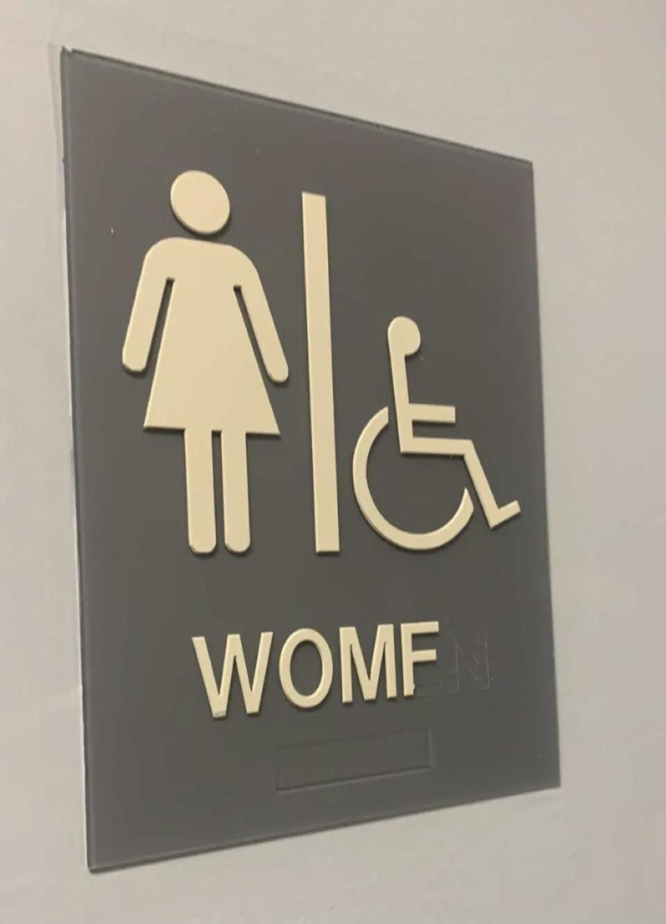 women's bathroom sign that reads womf