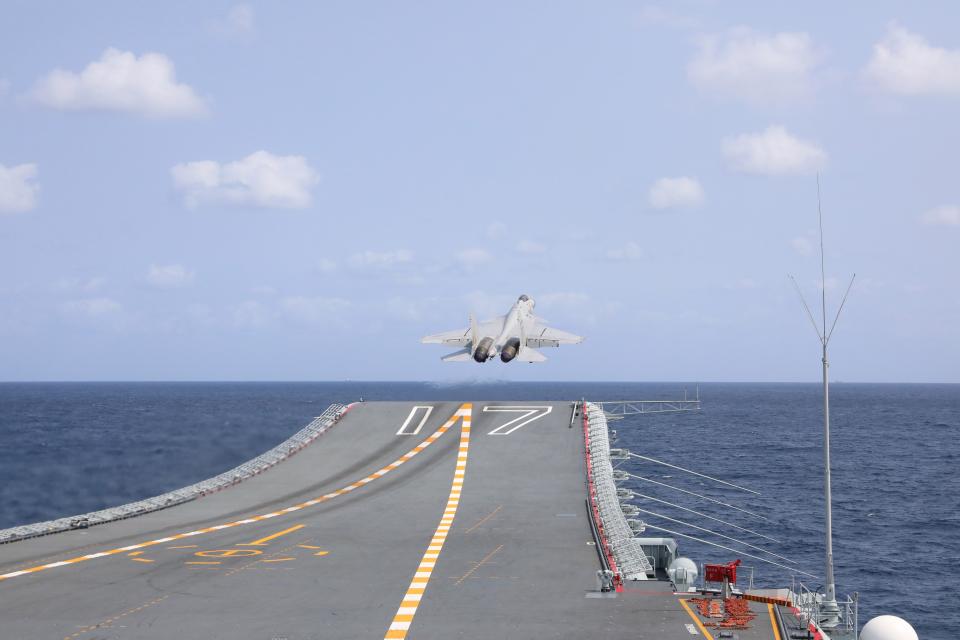 A J-15 fighter taking off from aircraft carrier Shandong