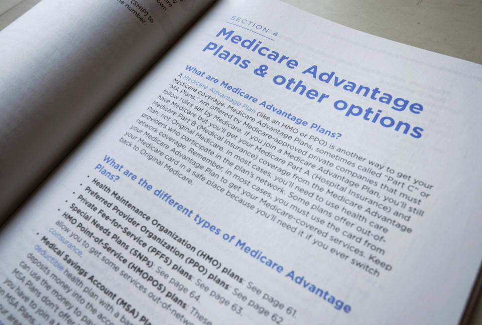 FILE - This Nov. 8, 2018 file photo shows a page from the 2019 U.S. Medicare Handbook in Washington. Medicare open enrollment starts soon, but 7 in 10 Medicare beneficiaries say they don’t compare Medicare plans during this period, which stretches from Oct. 15 to Dec. 7, 2022.  (AP Photo/Pablo Martinez Monsivais, File)