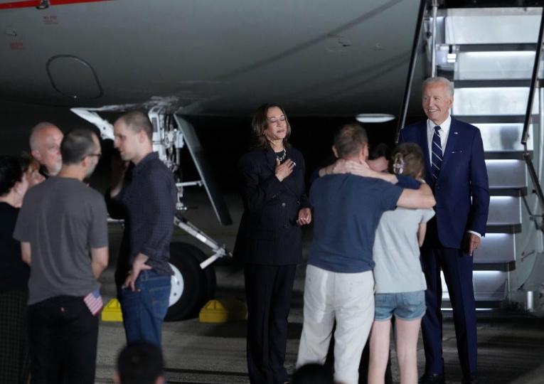 President Biden and Vice President Kamala Harris welcome Paul Whelan, Evan Gershkovich and Alsu Kurmasheva, all prisoners freed by Russia, as they arrive on Aug. 1, 2024, at Joint Base Andrews, Maryland. Their release, negotiated as part of a 24-person prisoner exchange with Russia that involved at least six countries, is the largest prisoner exchange in post-Soviet history. / Credit: Getty Images