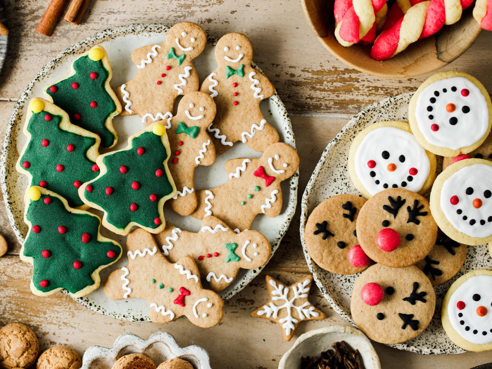 Top view of assorted Christmas cookies on festive table. High angle view of variety fo gingerbread cookies  presented on festive table for Christmas celebration.