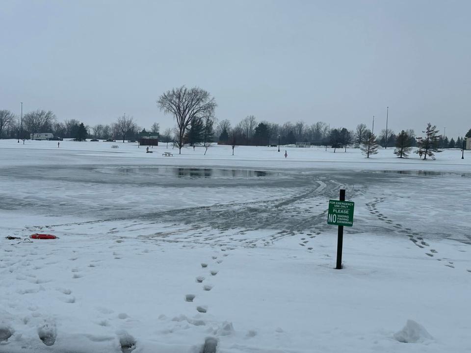 The pond next to the Cabela's store in Dundee is pictured Jan. 23, 2024, after a 12-year-old boy who had fallen through the ice was rescued.