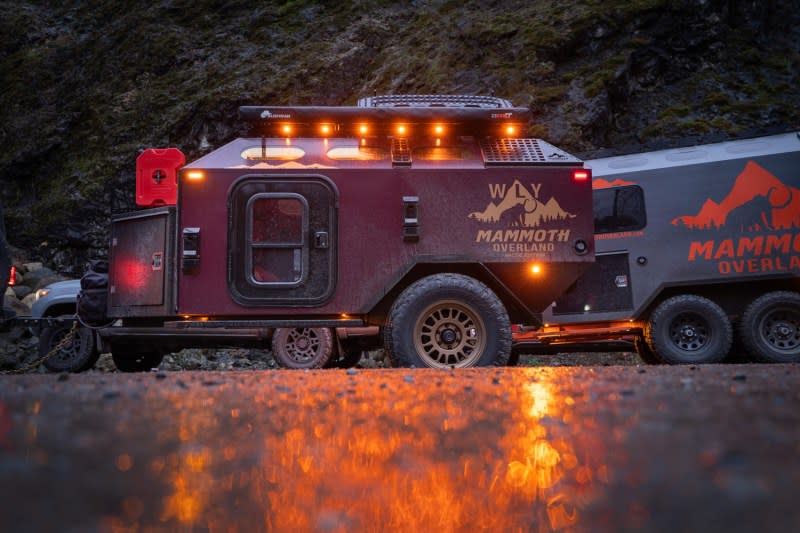 Mammoth Overland WLY Mammoth towable travel trailer lit up at dusk.