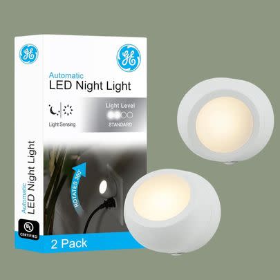 A pair of rotating LED night lights