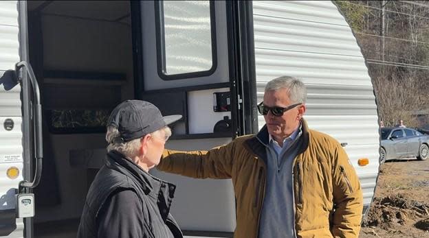 Gov. Josh Stein talks outside a trailer