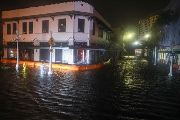 FORT MYERS BEACH, FLORIDA - OCTOBER 09: Surge waters flood the street after Hurricane Milton made landfall in the Sarasota area on October 09, 2024, in Fort Myers, Florida. Milton, coming on the heels of the destructive Helene, hit as a category 3 storm with winds of over 100 mph, though veering south of the projected direct hit on Tampa. Instead, the storm, which earlier had reportedly spawned tornadoes, landed about 70 miles south of Tampa near Siesta Key, a strip of white-sand beaches that's home to 5,500 people, according to published reports.. (Photo by Joe Raedle/Getty Images)