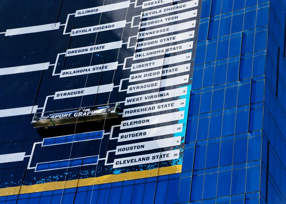 The bracket banner is updated on the side of the J.W. Marriott with the results of the first day of games during the 2021 NCAA Division I basketball tournament in Indianapolis, Indiana, on Saturday, March 20, 2021. Mandatory Credit: Barbara Perenic/IndyStar via USA TODAY Sports