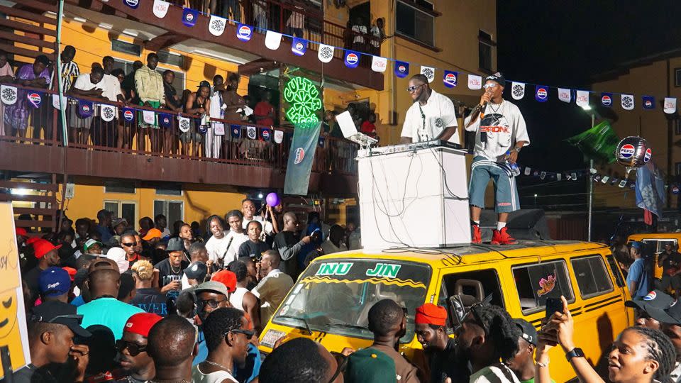 DJ K.A.S. and Toby Shang entertain the crowds in Surulere in December 2024. - Funlenses