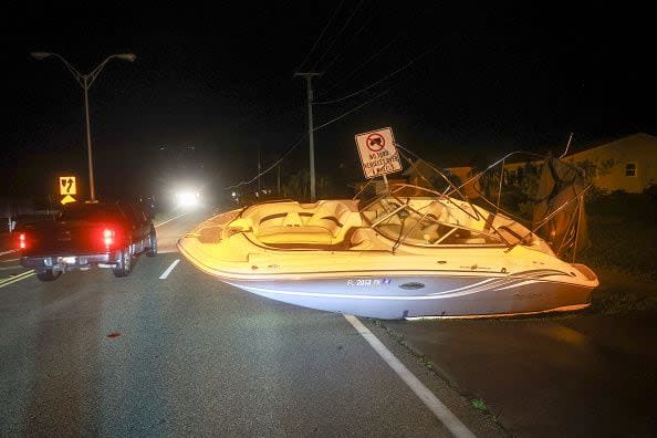 PORT CHARLOTTE - OCTOBER 10: A boat rests on a road after Hurricane Milton came ashore on October 10, 2024, in Port Charlotte, Florida. The storm came ashore as a Category 3 hurricane in the Siesta Key area of Florida, causing damage and flooding. (Photo by Joe Raedle/Getty Images)