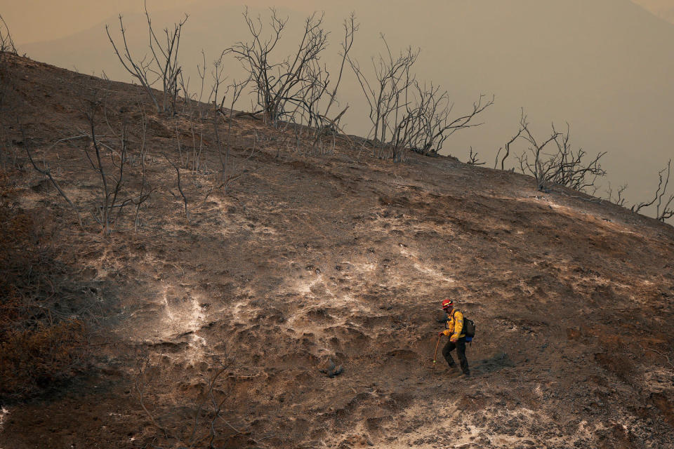 Image: Powerful Winds Fuel Multiple Fires Across Los Angeles Area firefighter hillside palisades fire (Justin Sullivan / Getty Images)