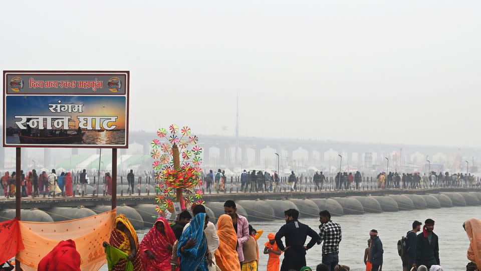 Devotees cross the pontoon bridge as they arrive to take dip into Sangam at Mahakumbh Nagar in Prayagraj, India on January 12, 2025. - Deepak Gupta/Hindustan Times/Getty Images