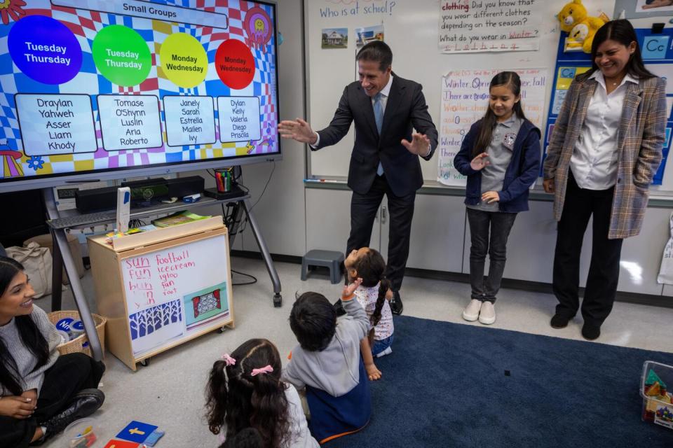 Los Angeles Unified School District Superintendent Alberto Carvalho, waves as he visits a classroom.