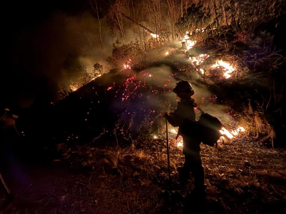 Firefighters monitor the North Fork fire through the night of Jan. 29, 2025.