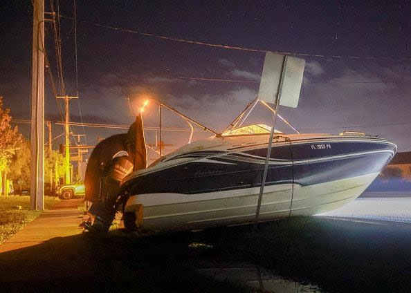 PORT CHARLOTTE - OCTOBER 10: A boat rests on a road after Hurricane Milton came ashore on October 10, 2024, in Port Charlotte, Florida. The storm made landfall as a Category 3 hurricane in the Siesta Key area of Florida, causing damage and flooding throughout Central Florida. (Photo by Joe Raedle/Getty Images)