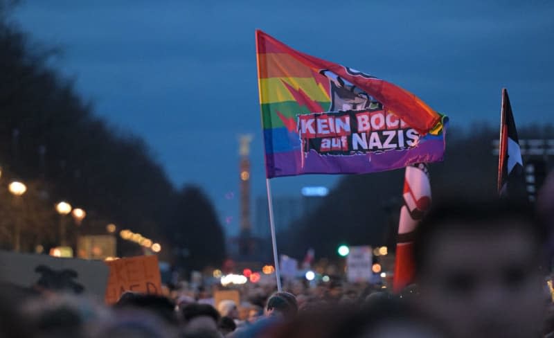 "Kein Bock auf Nazis" is written on a flag during a demonstration against the right in front of the Brandenburg Gate. Hannes P Albert/dpa