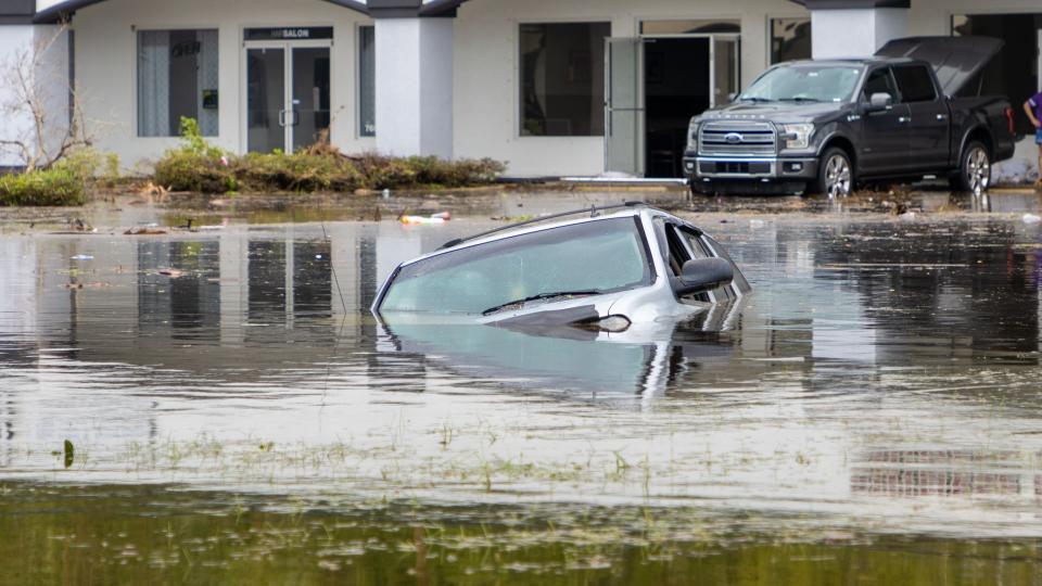 A car submerged in a pond after Hurricane Milton blew through Port Orange, FL in Oct. 2024.