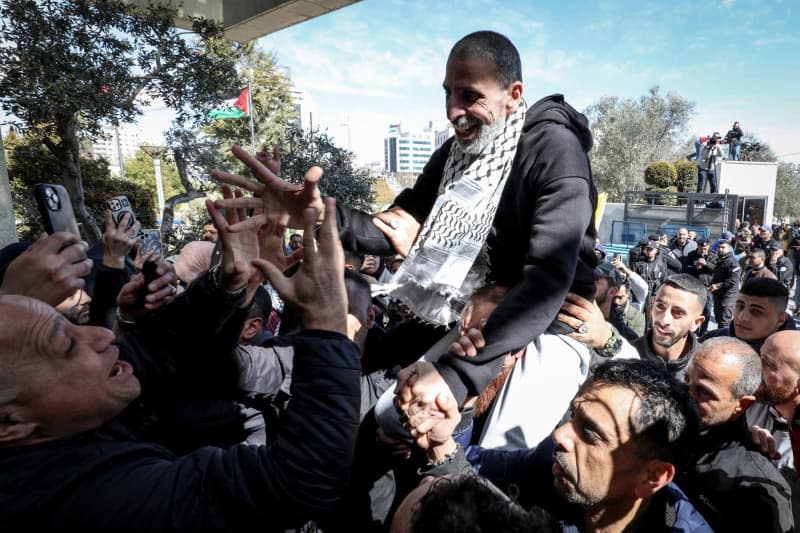 A freed Palestinian prisoner is greeted upon his arrival in the West Bank city of Ramallah, after being released from an Israeli prison in the latest hostages-prisoners exchange between Israel and Hamas. Ayman Nobani/dpa