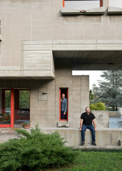 A brutalist masterwork in the north of Italy, designed by architect Carlo Graffi in 1971 for the owner of a concrete company, had been uninhabited for 16 years when Fabian Nagel and Roberto Mazzilli (from left) purchased it in 2019. The couple’s sparing restoration left the home’s exterior virtually unchanged and the interior only modestly updated.