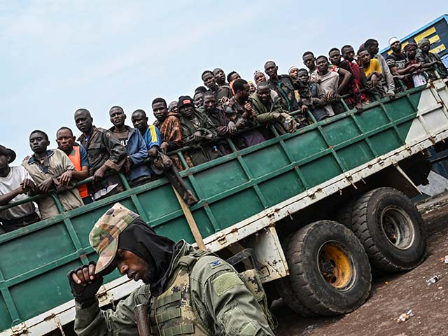 M23 rebels escort government soldiers and police who surrendered to an undisclosed location in Goma, Democratic Republic of the Congo, Thursday, Jan. 30, 2025.(AP Photo/Moses Sawasawa)