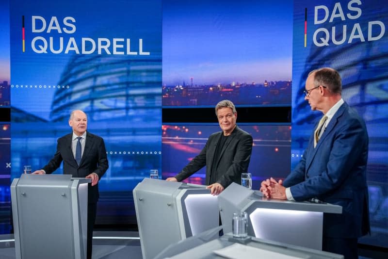 (L-R) Germany's Chancellor Olaf Scholz, Robert Habeck, lead candidate of Alliance 90/The Greens, vice-chancellor, and German minister for economic affairs and climate protection, and Friedrich Merz, top candidate of the Christian Democratic Union (CDU) and Christian Social Union (CSU) for chancellor, take part in the "Quadrell" TV discussion on the Bundestag election campaign in the studio. Kay Nietfeld/dpa-Pool/dpa