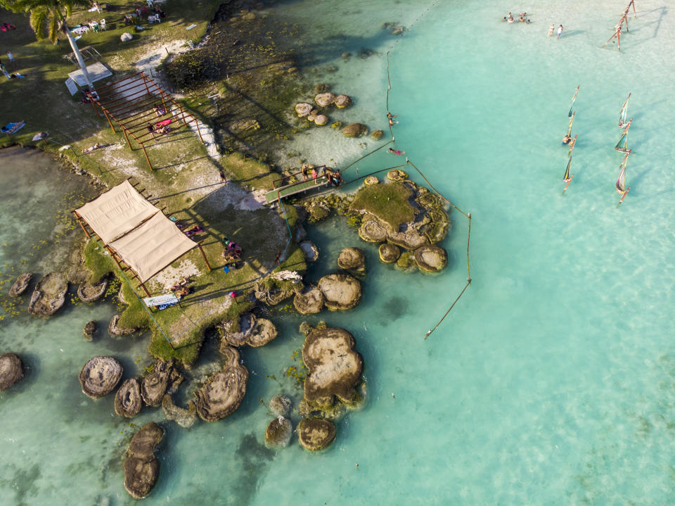 Aerial Drone Shot of Ancient Stromatolites also known as Alive stones in seven colores lagoon near Bacalar, Quintana Roo, Mexico