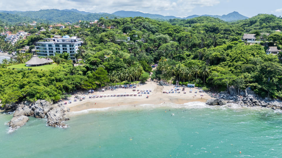 Tourists Enjoying Paradise Beach Los Muertos in Sayulita, Nayarit. Mexico