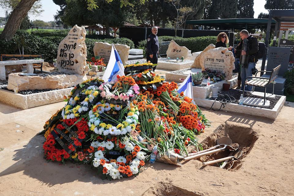 Thousands of mourners, carrying flags and orange balloons, joined the funeral procession on February 26 for Shiri Bibas and her two sons, who were among the hostages taken by Palestinian militants in Gaza in October 2023, and died during their captivity.  (Jack Guez / AFP via Getty Images)