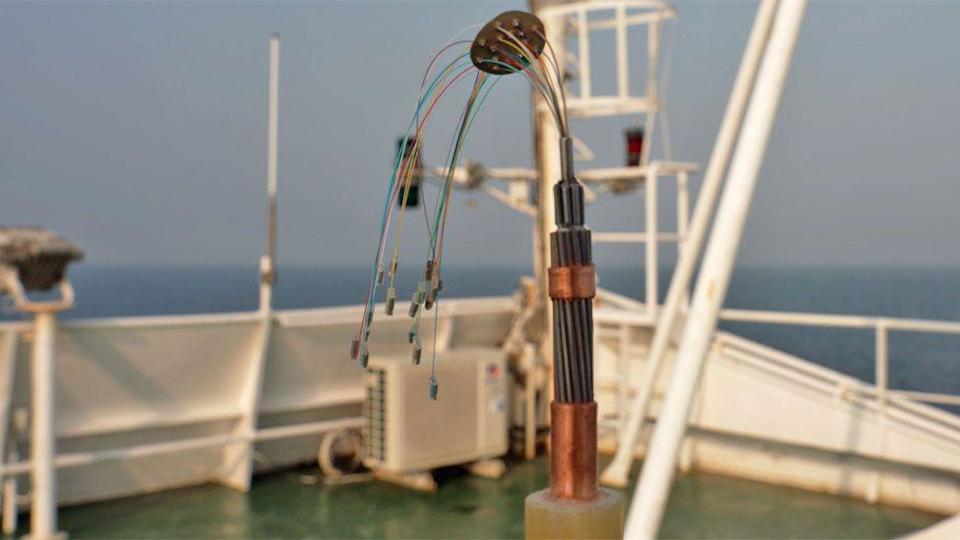 Several different coloured wires poke out of a tube seen on the deck of the Léon Thévenin.