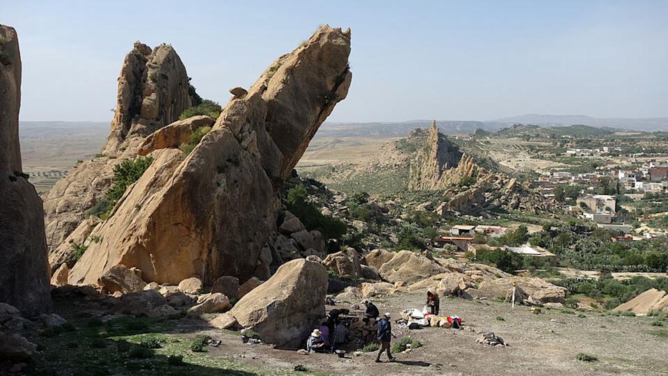 a photo of a desert landscape with large, angular rock formations