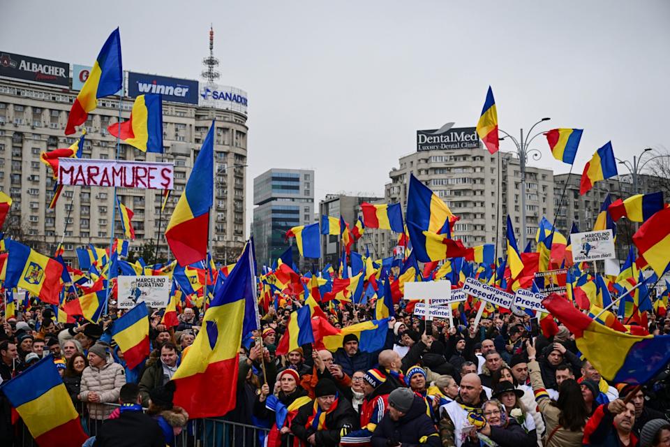 <span>Supporters of Calin Georgescu take part in a protest in Bucharest on March 1, 2025</span><div><span>Daniel MIHAILESCU</span><span>AFP</span></div>