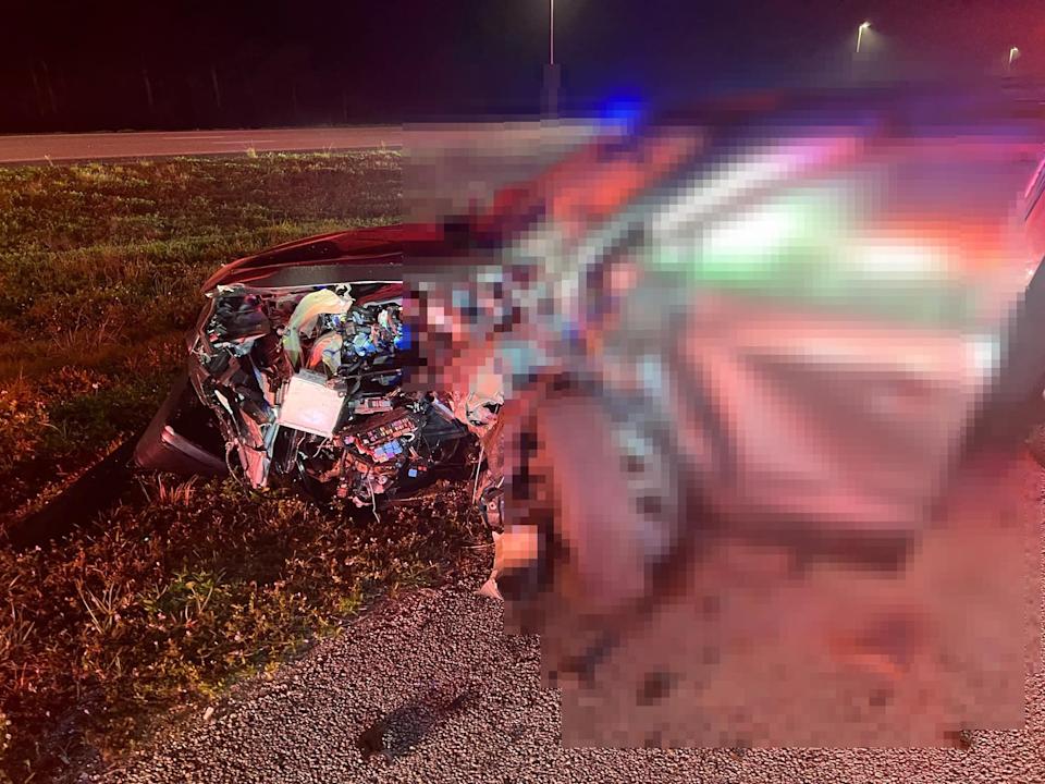 Wreckage from a wrong-way crash early Saturday near Palm City lies in the median of Interstate 95.