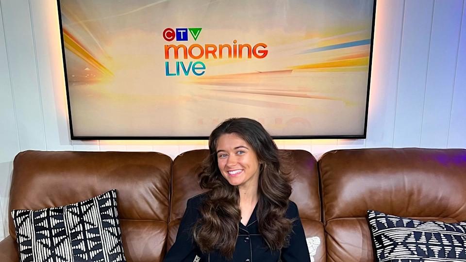 Clíodhna Ní Chorráin sits on a brown sofa wearing a black blazer underneath a sign that says 'CTV Morning Live'.