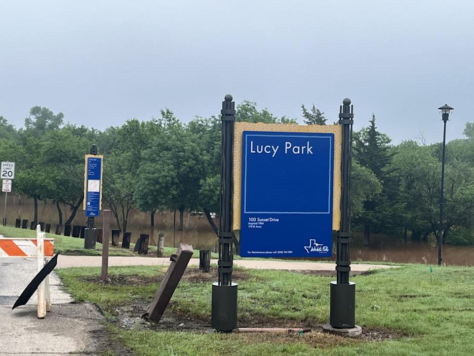 The entrance to Lucy Park was barricaded Thursday morning as the Wichita River rose to inundate the large park.