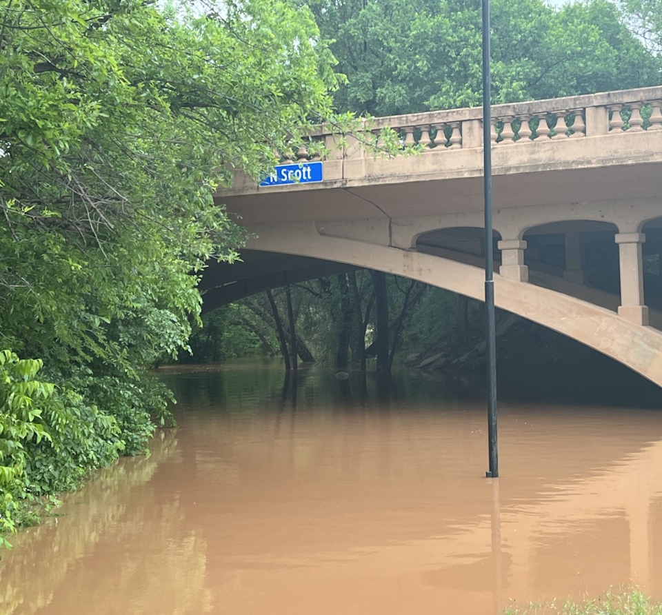 The Wichita River rises eerily beneath the old North Scott Avenue bridge early Thursday.