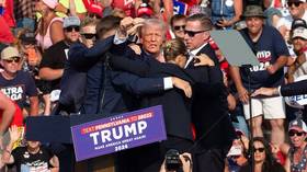 Trump hit by bullet at election rally (VIDEO)