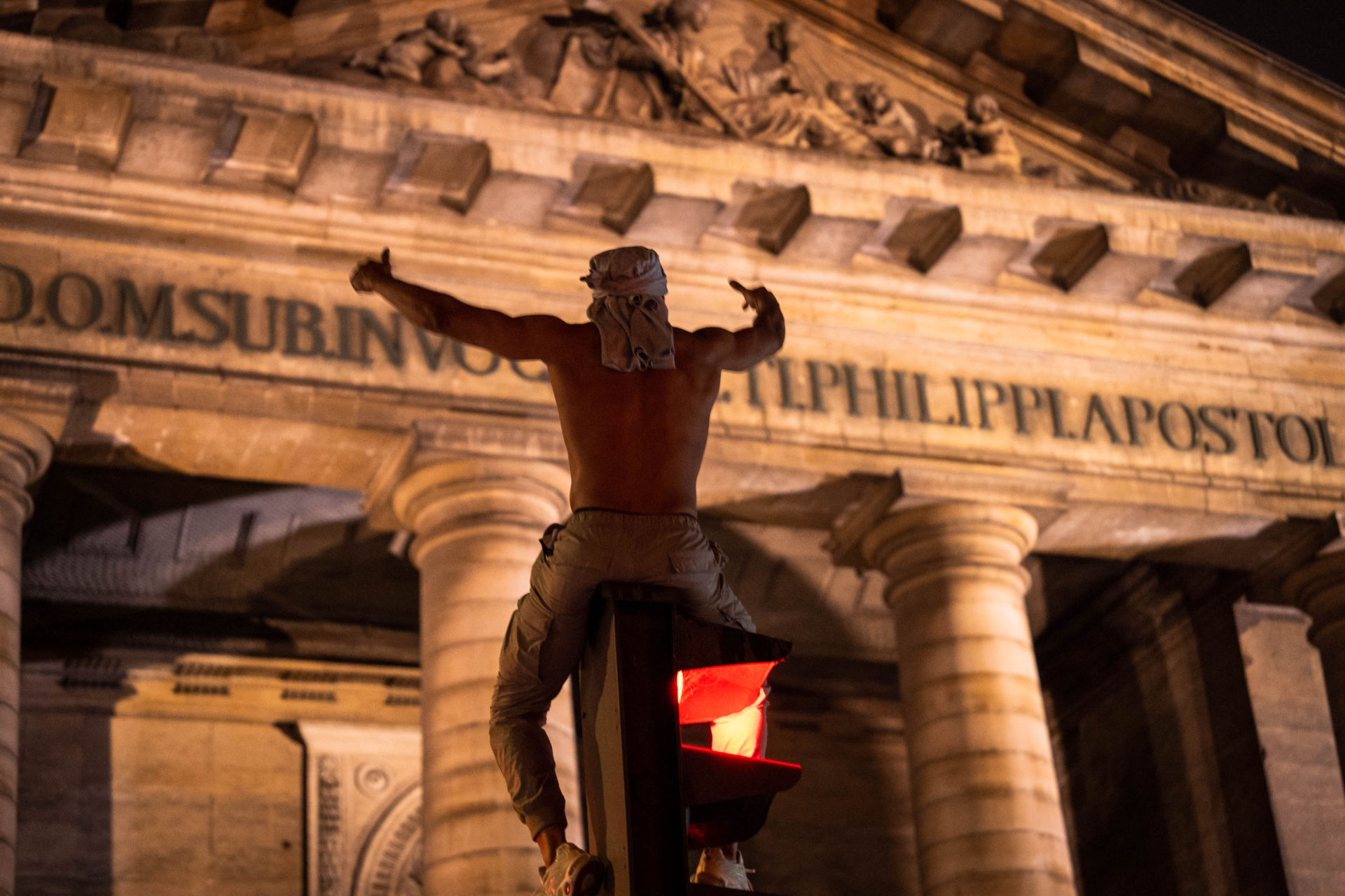 A Paris Saint-Germain (PSG) supporter celebrates in Paris early June 1, 2025, following their 5-0 victory in the UEFA Champions League final football match against Inter Milan held in Munich. (Photo by Nael Chahine / Middle East Images / Middle East Images via AFP) (Photo by NAEL CHAHINE/Middle East Images/AFP via Getty Images)