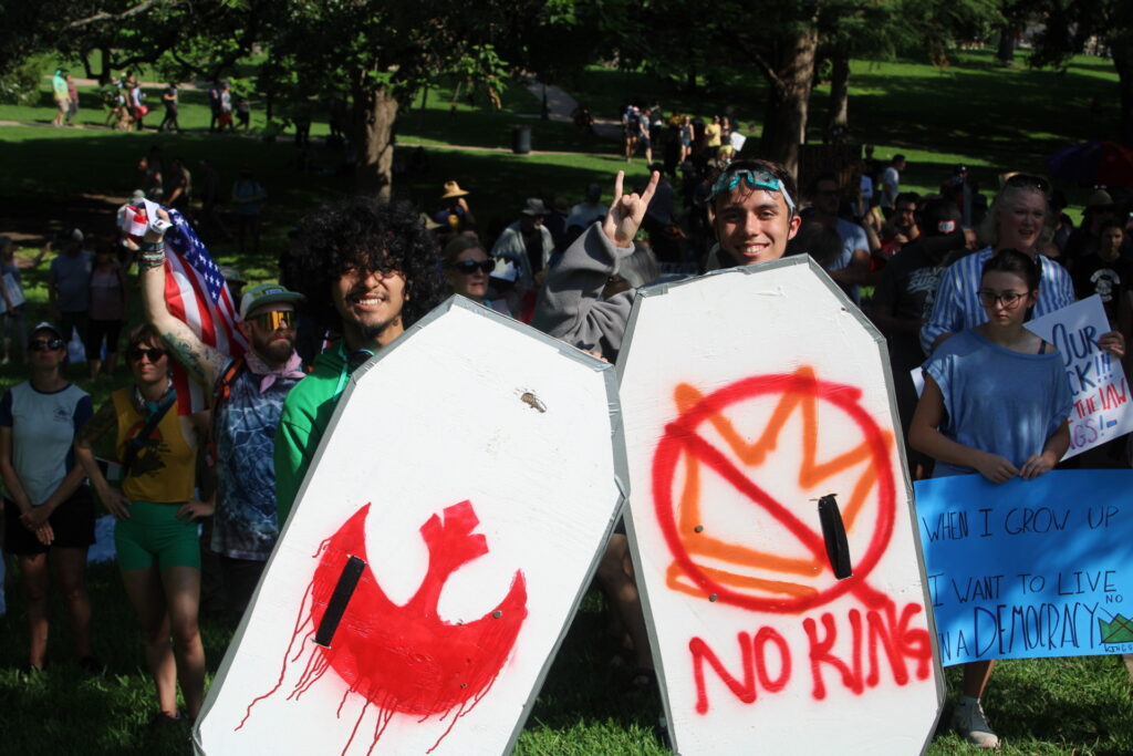 Protesters carry wooden shields at Democrat No Kings Protest (Randy Clark/Breitbart Texas)