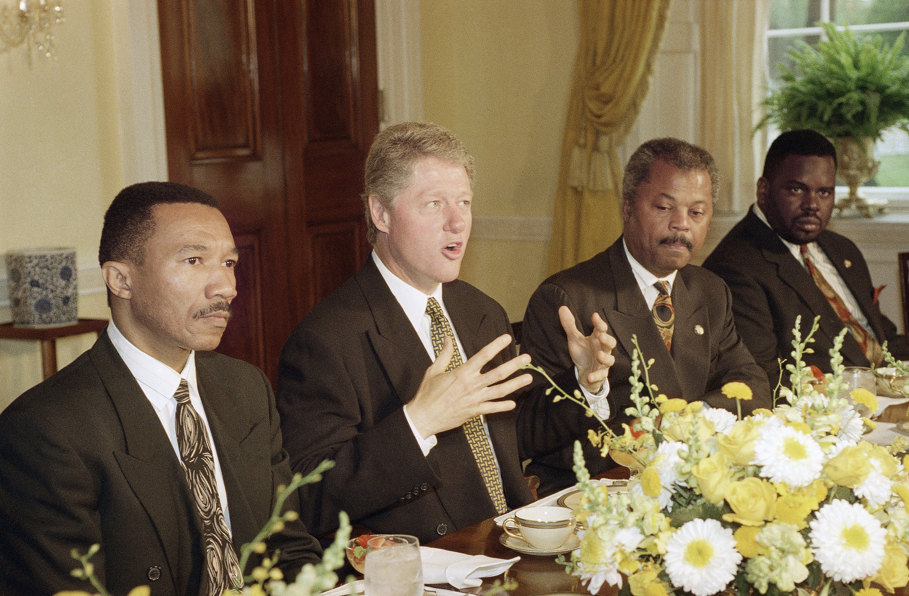 President Bill Clinton gestures while meeting with the Congressional Black Caucus at the White House in Washington, May 26, 1993. Rep. Kweisi Mfume (D-Md.), chairman of the caucus, left, and Rep. Donald Payne (D-N.J.), right, flank the president during the meeting.