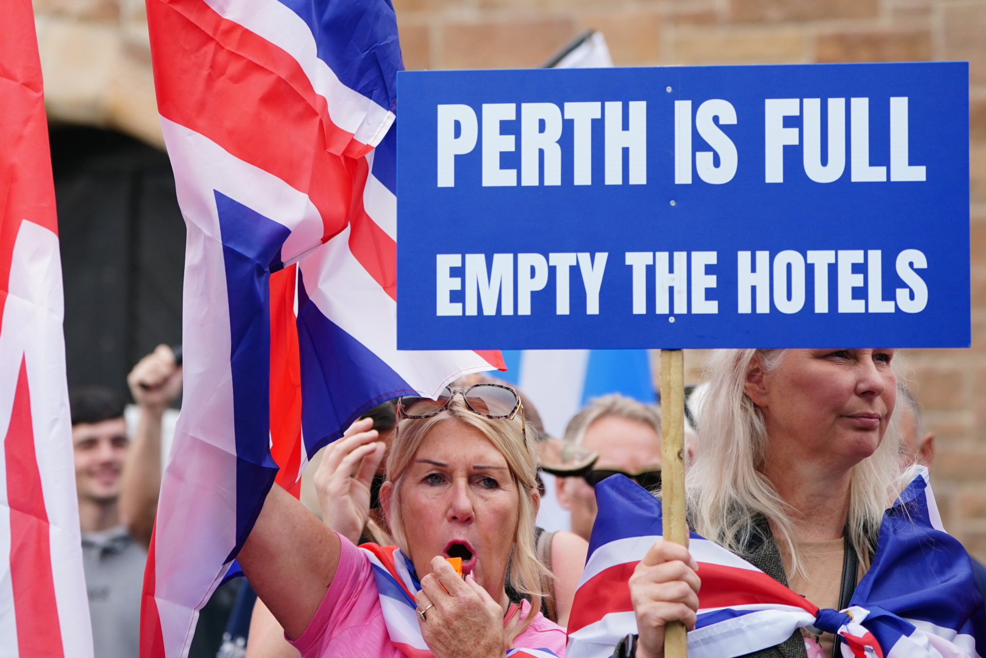 People demonstrating at an Abolish Asylum System protest outside the Radisson Hotel in Perth. Picture date: Saturday August 23, 2025. (Photo by Jane Barlow/PA Images via Getty Images)