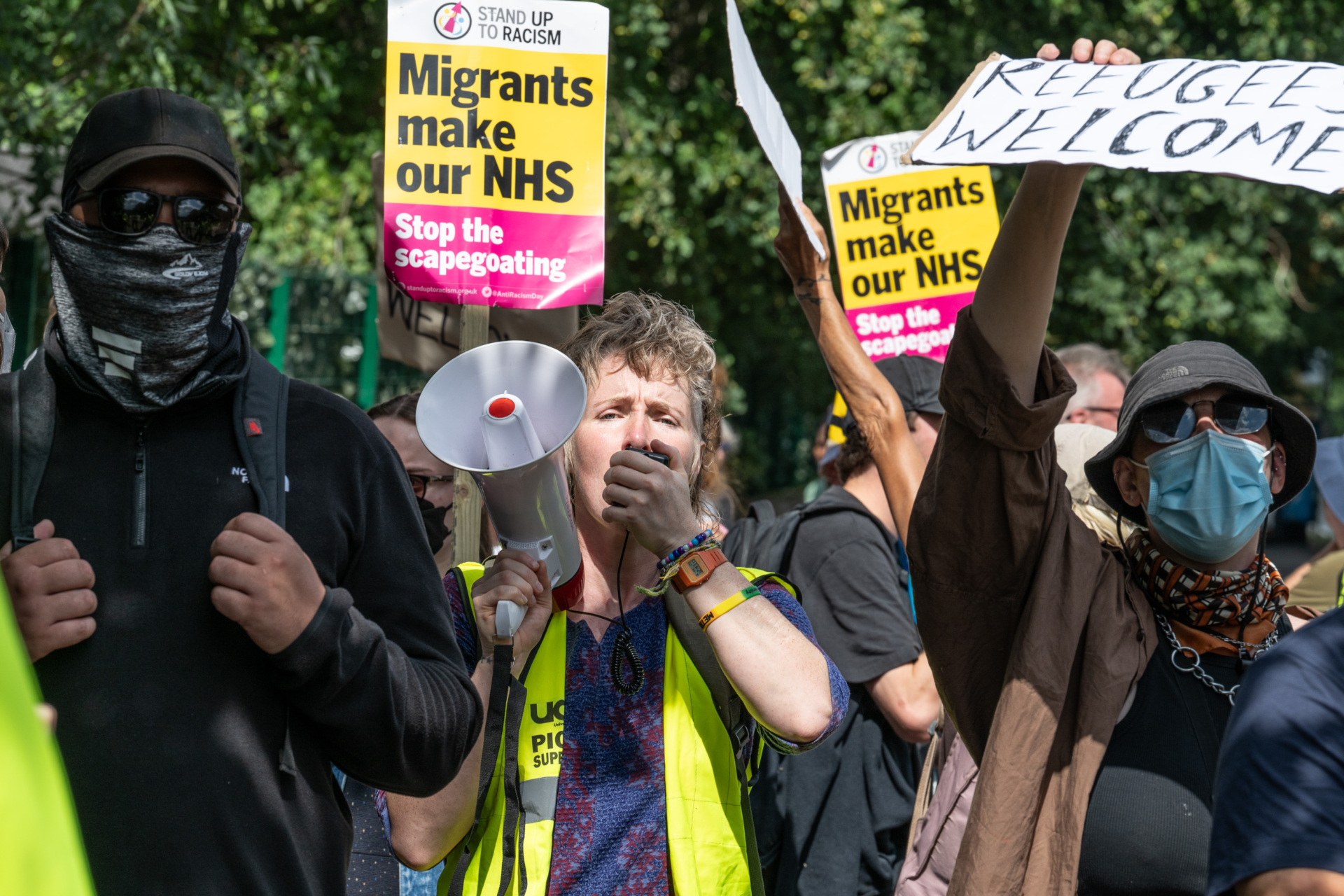 HORLEY, ENGLAND - AUGUST 23: A counter protest to the far-right demonstration by Stand Up To Racism and other antifascists on August 23, 2025 in Horley, England. Far-right protests at migrant hotels across the UK have been a feature of the summer months since demonstrations at The Bell Hotel in Epping earlier this summer. (Photo by Guy Smallman/Getty Images)