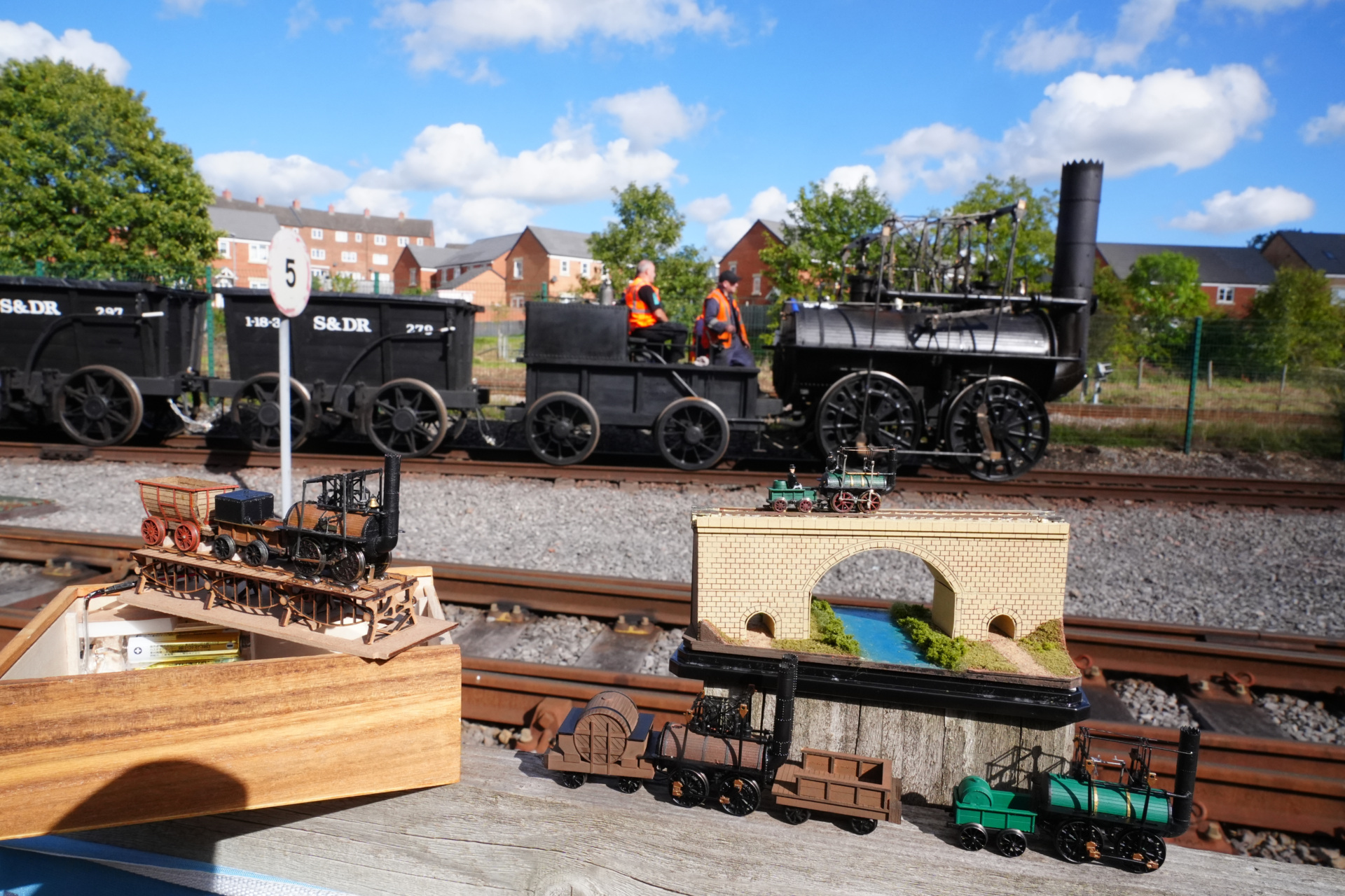 Locomotion No 1, which in 1825 was the first steam locomotive to pull a passenger-carrying train, passes a replica model of itself during a test run for 'The Railway 200 Special' at the Locomotion Museum in Shildon, County Durham, ahead of the 200th anniversary of the passenger railways on Saturday September 27. Locomotion No 1 was built in 1825 by George and Robert Stephenson and entered service in September 1825, on the opening day of the Stockton and Darlington Railway (S&DR), when it was driven by George Stephenson and hauling eleven wagons containing coal, and 20 wagons carrying passengers. Picture date: Thursday September 25, 2025. (Photo by Owen Humphreys/PA Images via Getty Images)