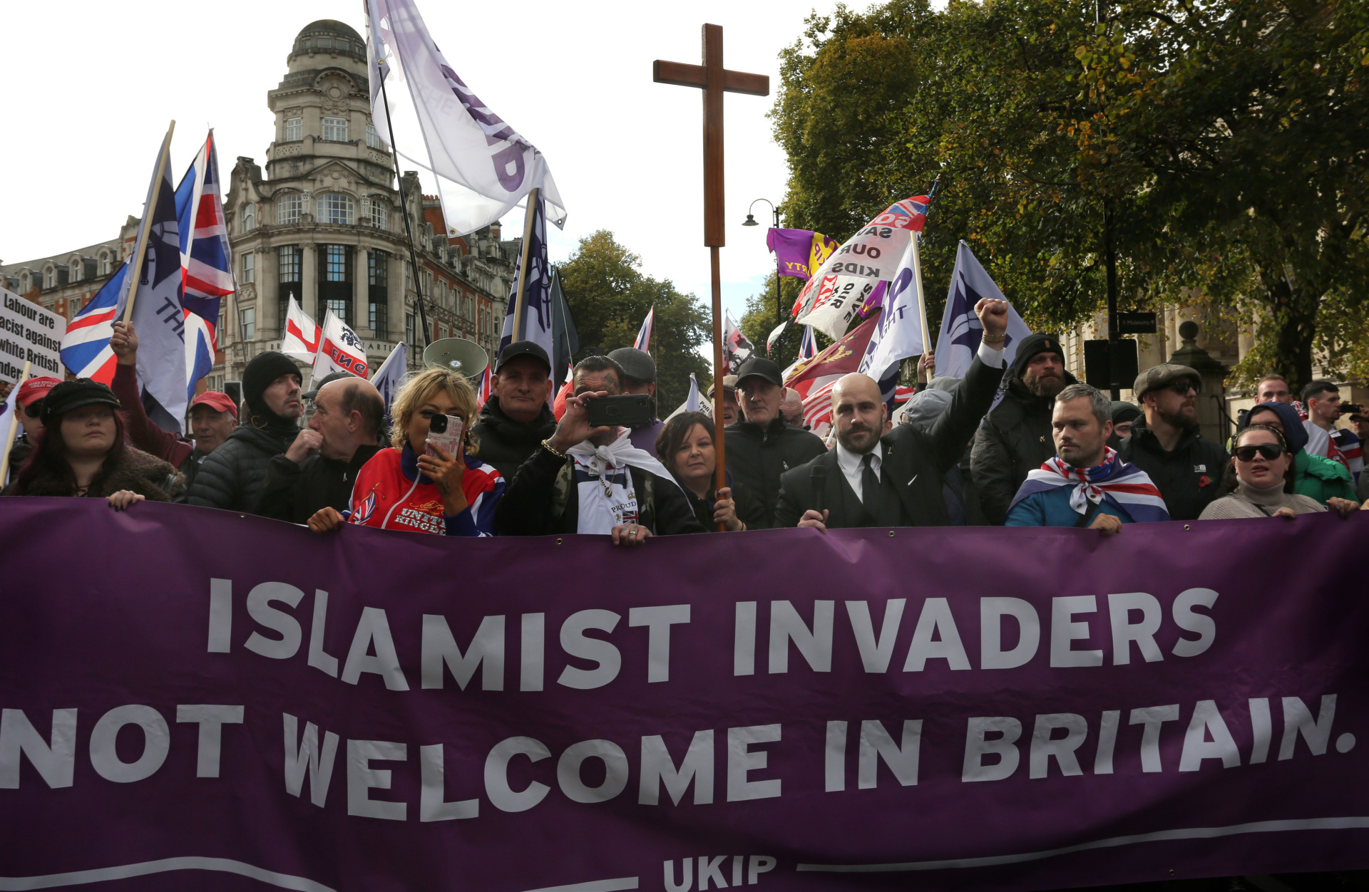 LONDON, ENGLAND - OCTOBER 25: Supporters of UKIP march to Hyde Park during the rally with leader Nick Tenconi at their head on October 25, 2025 in London, England. Supporters of UKIP re-route their 'Reclaim London From the Islamists' march across central London after they were prevented from marching in Whitechapel, Tower Hamlets by the police as they feared it could cause trouble in the largely muslim area. Police prevent counter-protesters from getting close to the march arresting any that strayed into the large exclusion zone and refused to leave. (Photo by Martin Pope/Getty Images)